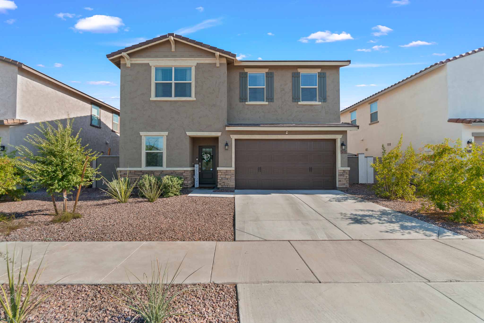 the front of a gray two-story home